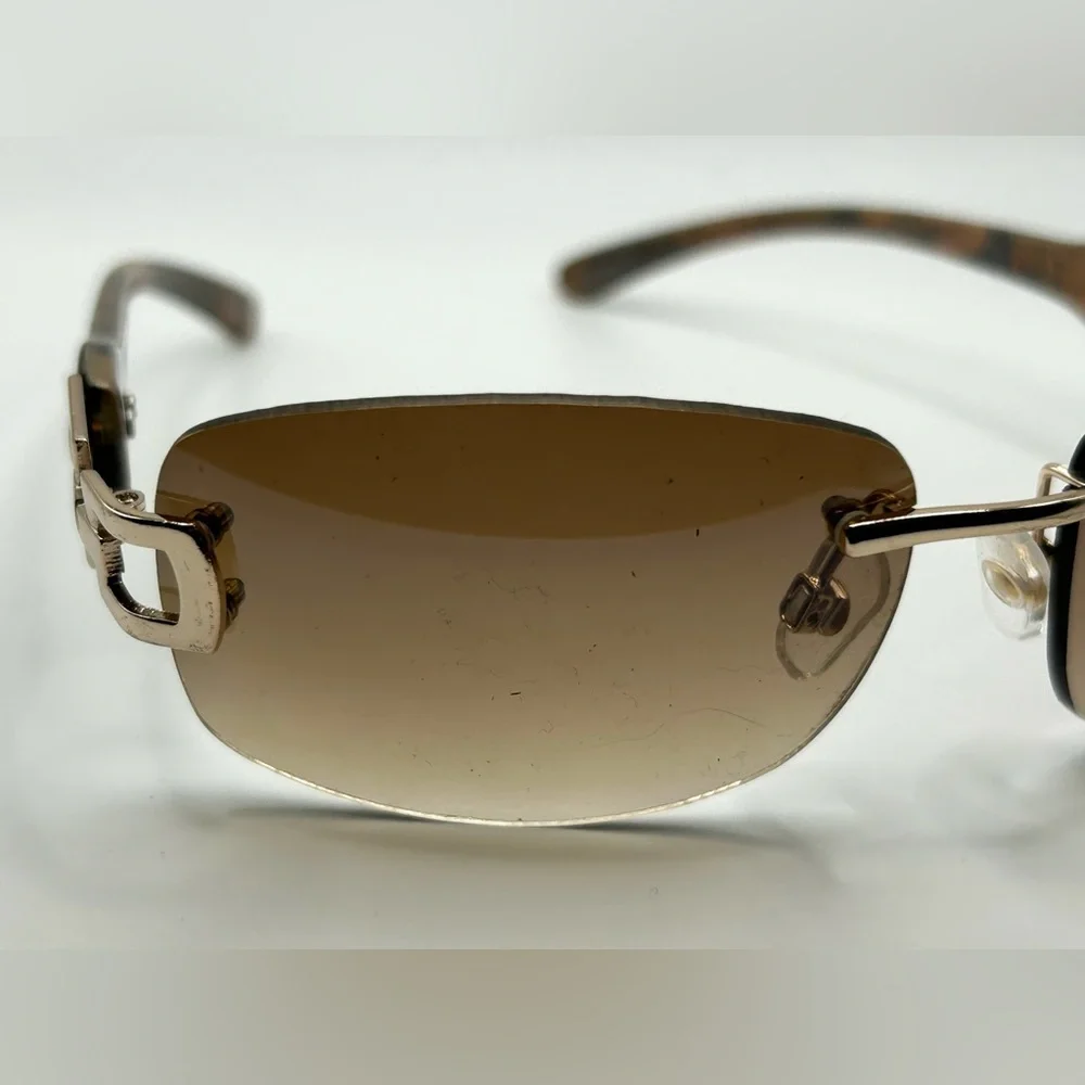 Vintage 90s Y2K Foster Grant Rimless gold link accent Sunglasses